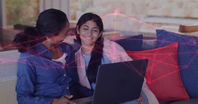 Mom and daughter leaning, adult tapping laptop, checking grades, smiling, network overlay animating