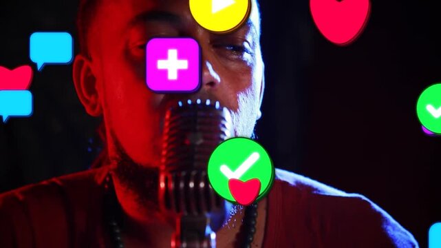 Vertical video: Singer playing guitar while camera rising causing icons covering face for fan reach