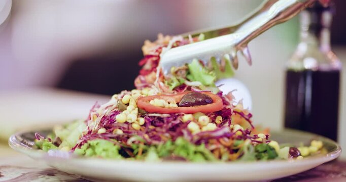 Friends gather at a fitness center to prepare fresh salads for a healthy group meal after their exercise session together