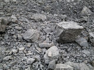 Fototapeta premium Grey Boulder Field and Loose Scree on a Mountain Slope in the Canadian Rockies, Canada