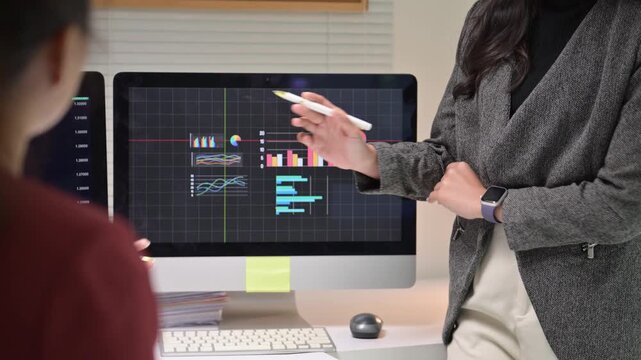 Financial analyst presenting stock market data on a computer screen