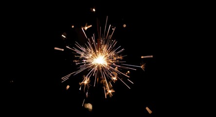 Obraz premium Zoomed photo of a sparking glowing sparkler perfect for festive and wedding moments