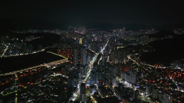 Aerial night vew of Busan city with Illuminated highrise and streets, South Korea