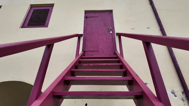 Pink Wooden Stairs Leading to the Old Door at Fort Rotterdam in Makassar City, Indonesia