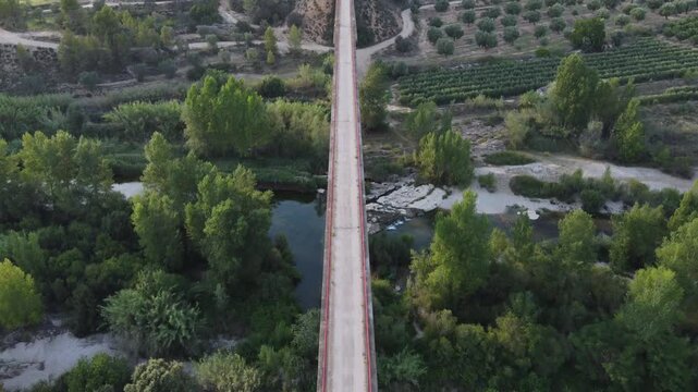 Flying over a viaduct above a stream. Matarra&ntilde;a river, Spain.