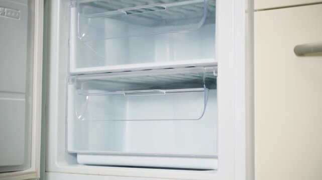Inside view of clean empty freezer drawer with tracking shot