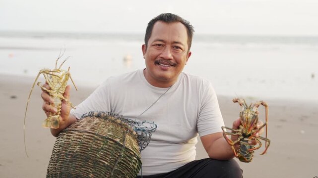 portrait, smiling lobster fisherman in tabanan, bali, indonesia, balinese people, sea in background
