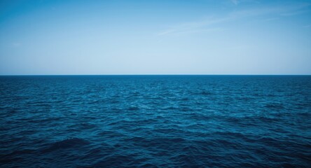 Obraz premium Tranquil ocean scene with deep blue waters and clear skies