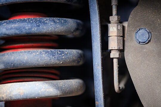 The suspension of a four-wheel drive pickup truck that has been used for rough use