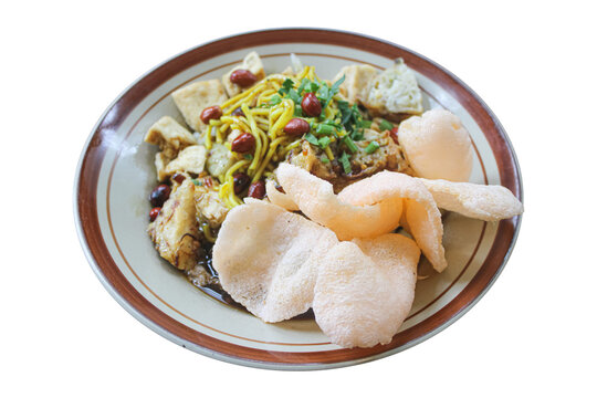 Traditional Indonesian Tahu Kupat with Yellow Noodles and Crackers
