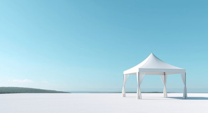 White tent structure framed by a cloudless blue sky with scenic calmness and copy space