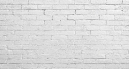 Fototapeta premium Textured white brick wall background with subtle shadows and copy space