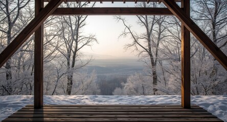 Fototapeta premium Winter wonderland panorama viewed from a sturdy lookout platform amidst bare trees