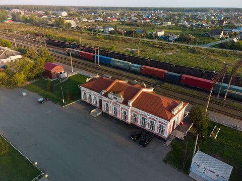 Golyshmanovo, Russia - August 21, 2021: High-angle drone shot of Golyshmanovo railway station in Golyshmanovo urban-type settlement, Tyumen region, Russia, on a sunny summer day. The image captures