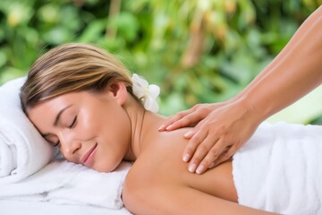 Obraz premium Woman receiving relaxing back massage at outdoor spa