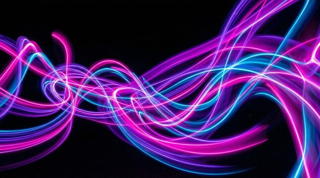 A vibrant abstract light painting with swirling neon pink and blue lines on a black background