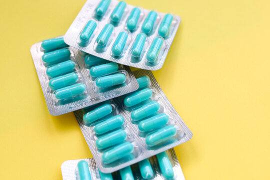 Blue capsules of Doxycycline in blister packs.