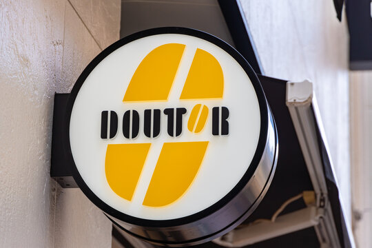 MUSASHINO, TOKYO, JAPAN - MARCH 24, 2026: The official branding logo sign of Doutor Coffee, a popular Japanese coffee shop chain, in Musashino, Tokyo.