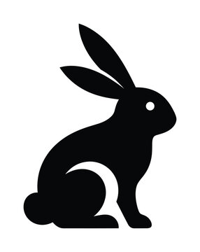 Minimalistic vector silhouette of a rabbit sitting upright with long ears pointing upwards
