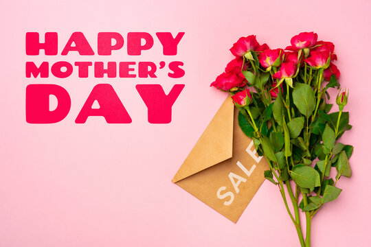 Happy Mother Day celebration on May 10 with roses and an envelope on a pink background