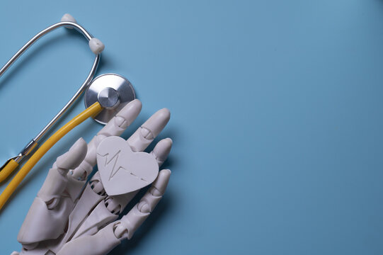 Robotic Hand Holding Heart with Stethoscope Representing AI Medical Diagnosis