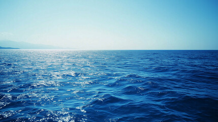 Obraz premium Blue sky over calm sea. Blue sea and sunny sky on horizon over calm water