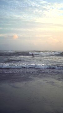 Kite Flying over Ocean with Kitesurfer at Canggu Beach Bali