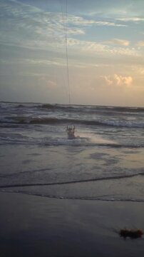 Kiteboarder Jumping in Air over Ocean Waves at Canggu Beach Bali