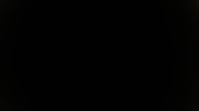 Solar eclipse progression showing bright ring of light, transitioning to a darkened center, culminating in totality with a complete black silhouette against the sky