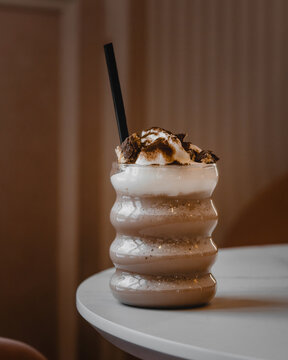 s'mores chocolate milkshake on a table in a cafe