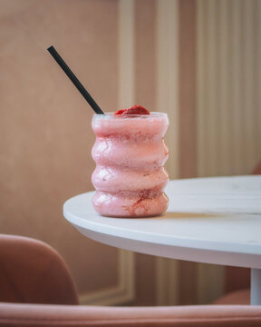 strawberry milkshake on a table in a cafe
