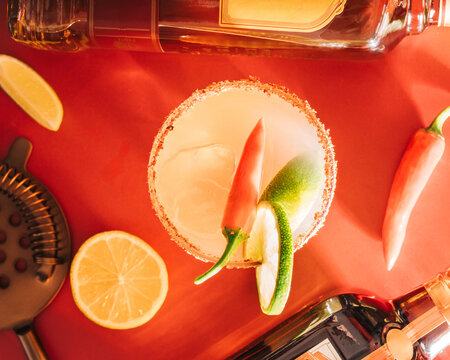 spicy margarita cocktail photographed in a studio with bottles