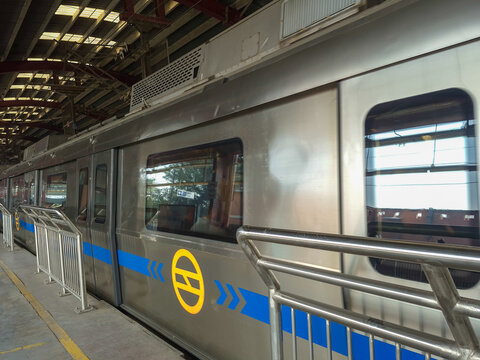 New Delhi, India, April 16 2025 - Delhi Metro train arriving at Jhandewalan metro station in New Delhi, India, Asia, Public Metro departing from Jhandewalan station