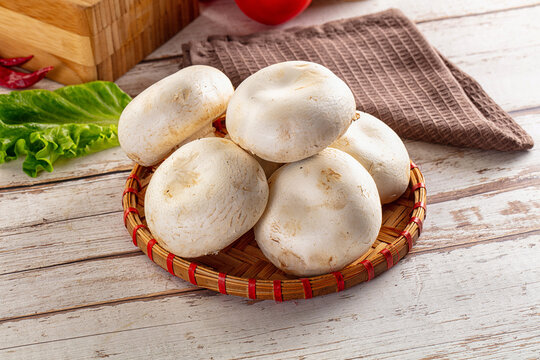 Raw white champignon mush heap