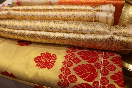 Traditional Assamese Mekhela Chador, handwoven Silk Fabric with Ethnic Motifs.