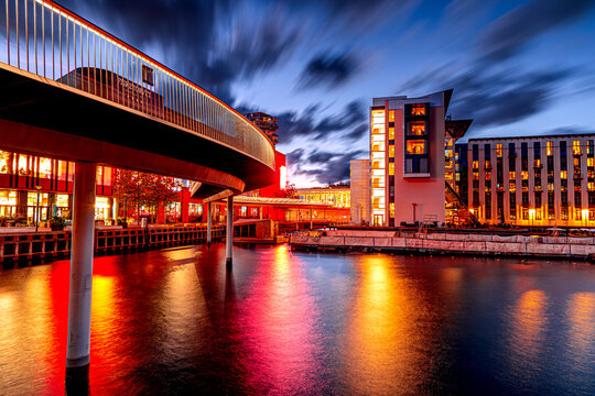 Copenhagen bike path at dusk, modern architecture in Danish capital.