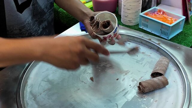 Street Vendor Serving Rolled Chocolate Ice Cream in Cup, Thai Dessert Ready to Eat, 4K