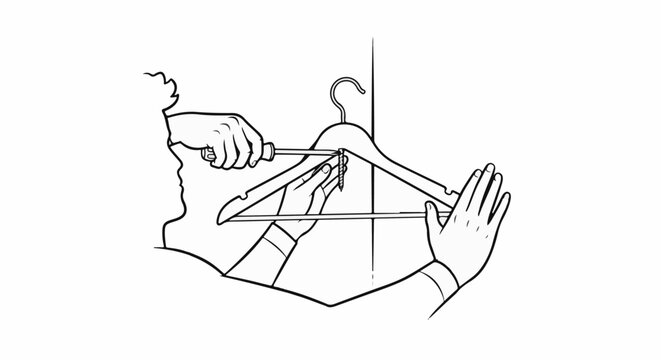 Hands assemble a clothes hanger using a screwdriver and screw