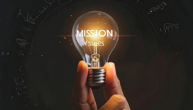 A glowing lightbulb with a hand and mission values