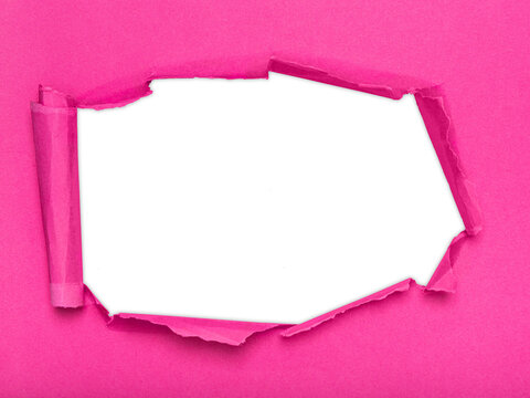 A piece of pink paper with a ripped hole revealing a transparent background