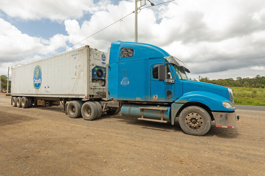 February 18, 2026: Blue semi-truck transporting a Chiquita refrigerated container (Musa) on the road. Puerto Limon, Caribbean, Costa Rica.