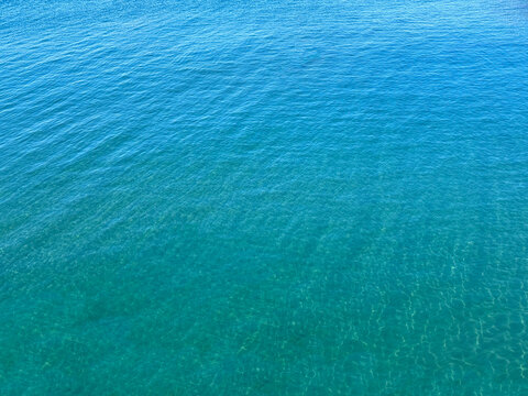 Blue ocean or sea calm water surface background.