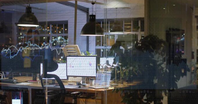 Empty workstation seen through glass showing animated waveform emerging left, visualizing finance