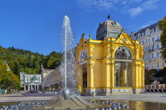 Main Spa Colonnade and Singing Fountain in Marianske Lazne, Czech Republic. Neobaroque architecture under blue sunny sky