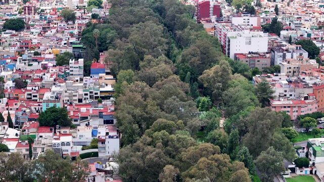 Lateral dron shot of river and park in mexico city