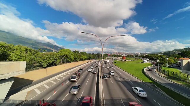 Timelapse of Caracas cityscape with traffic under a dramatic cloudy sky