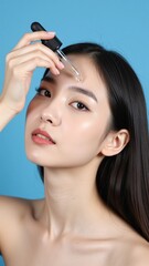 Fototapeta premium Serene Asian Model Applying Premium Serum