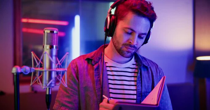 Mic, man and reading with notebook for broadcast, talk show and script for podcast. Media agency, content creation and male person with tech for live streaming, studio recording or audio hosting