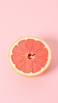 Minimalist Sliced Grapefruit on Pastel Pink