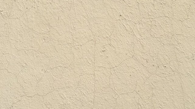 Cracked beige plaster texture background